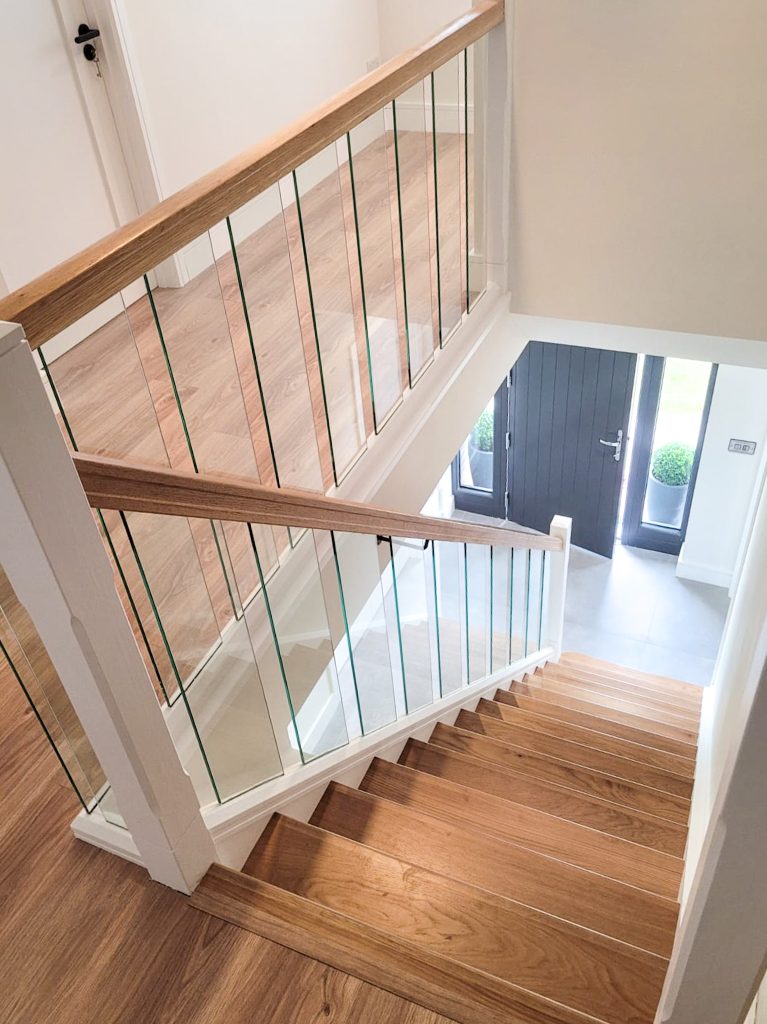 Staircase finished in Oak & Glass toughened glass.